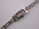Close-up, top-down view of the Gucci 3900 L watch dial and the upper part of the integrated bracelet.