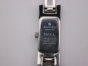 Detailed close-up of the Gucci 3900 L case back engraving, showing brand, model, serial number '0300654', and 'WATER RESISTANT 3 ATM'.