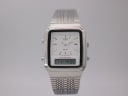 Front view of the Citizen C480 ana-digi watch with a white dial and silver mesh bracelet on a light grey background.