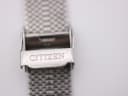 Close-up of the polished stainless steel fold-over clasp, clearly showing the "CITIZEN" signature engraving.