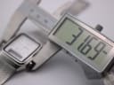 Digital caliper measuring the case width of the Citizen C480, displaying a precise measurement of 31.69mm.
