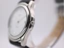 Side view of Tissot PR 50 watch showing the silver case and signed crown.