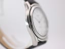 Side view of Tissot PR 50 watch, showing the sleek profile of the silver stainless steel case.