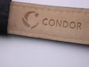Close-up of the inner side of the black leather strap, showing "CONDOR" brand embossing.