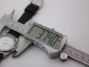 Digital caliper measuring the Tissot PR 50 case diameter at 37.40mm.