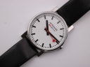Close-up of the Mondaine white dial with "SBB CFF FFS" text and "Swiss Made" detail.