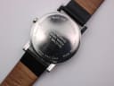 Close-up of the polished stainless steel case back with "Official Swiss Railways Watch" and "Water Resistant" engravings.