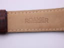 Underside of the brown leather strap, showing the embossed "ROAMER" branding.