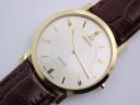 Close-up front view of the Roamer Slim Line watch dial, showing gold-tone baton indices, hands, and Roamer logo.