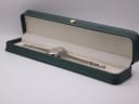 Vintage Mortima watch displayed inside a generic green leatherette presentation box (studio prop).