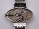 Open case back showing the 17 jewel manual wind watch movement with '17 JEWELS C.M.C' visible.