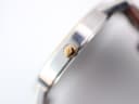 Close-up of the gold-tone crown, featuring the classic Bulova tuning fork logo.