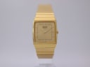 Front view of the gold-tone Seiko 6530-5760 watch with its square dial and integrated bracelet, against a plain background.