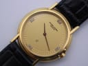 Close-up of gold Favre-Leuba dial with diamond markers and textured outer ring, showing 'Favre-Leuba Genève' text.