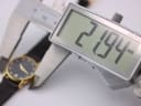 A digital caliper measuring the case diameter of the Raymond Weil watch, displaying a precise measurement of 21.94mm.