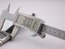 Digital caliper measuring the case diameter of the Rotary Revelation watch, displaying 30.07mm.