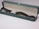 Rotary Revelation watch with white dial displayed in a generic green leatherette presentation box.
