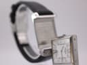 Rotary Revelation watch with white Roman numeral dial rotated open, revealing the watch's case back.