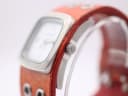 Side view of Nixon watch case showing crown with logo.