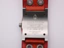 Close-up of Nixon case back engraving with model name, water resistance, and movement details.