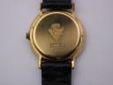 Detailed close-up of the gold-plated case back, showing the Gucci crest, model number 3000.2.L and serial number.
