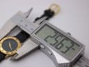 Digital caliper measuring the case diameter of the Gucci watch at 26.37mm.