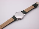 Rear view of the Mondaine watch, showing the stainless steel case back engravings and the 'CONDOR GENUINE LEATHER' strap interior.