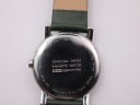 Detailed close-up of the stainless steel case back with Mondaine branding and 'Water Resistant' text.