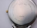 Detailed view of the stainless steel case back, with crisp engravings for model T870/970, serial, "SAPPHIRE CRYSTAL", "WATERRESISTANT 30M", and "STAINLESS STEEL".