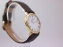 Opposite angled side view of the Raymond Weil watch, highlighting the case profile and strap.