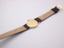 Rear view of the Raymond Weil watch on its strap, showing the unbranded brown leather strap.