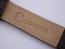 Close-up of the inside of the brown leather strap, showing the 'CONDOR' brand embossing.