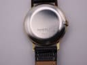 Close-up of the polished stainless steel case back with 'STAINLESS STEEL BACK SWISS MADE 7000' engraving.