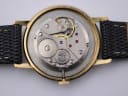 Open case back showing the 17-jewel Swiss manual wind movement with visible gears and rubies.