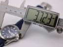 Digital caliper measuring the case diameter of the Seiko watch, displaying 37.23mm.