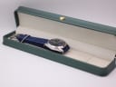 The Seiko watch resting inside a green leatherette display box (studio prop).