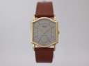 Front view of the gold-tone Seiko 2628-5030 watch with a silver dial and brown leather strap.