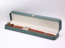 The Seiko watch presented in a green leatherette display box (studio prop).