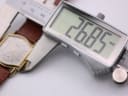 Digital caliper measuring the case diameter of the Seiko watch, displaying 26.85mm.