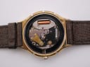 Open case back revealing the quartz movement with battery and internal components.