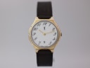 Front view of the Yves Saint Laurent 51159 watch with a white dial, gold-tone case, and brown leather strap.