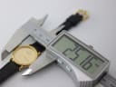 Digital caliper measuring the case diameter of the Raymond Weil watch, displaying 25.16 mm.