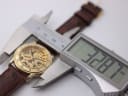 Digital caliper measuring the case diameter of the Accurist watch at precisely 32.87mm.
