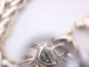 Extreme close-up of the clasp, showing 'ITALY' engraving