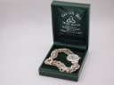 Precious Time watch resting in a 'Carrick Art Celtic Silver' presentation box
