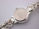 Close-up of the Precious Time watch case back with 'Japanese Movement Made in China' engraving