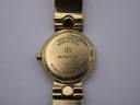 Rear view of the gold tone Raymond Weil watch, displaying the case back and bracelet curvature.
