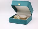 The Rotary LB5004 watch displayed inside a green generic presentation box with a gold crown emblem.