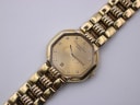 Close-up of the Christian Dior watch dial, showing brand name, 'CD' monogram, diamond markers, hands, and date display.