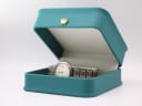 The Seiko 7N82-0420 titanium watch resting inside a green leatherette presentation box, a common studio prop for London Watch Market.